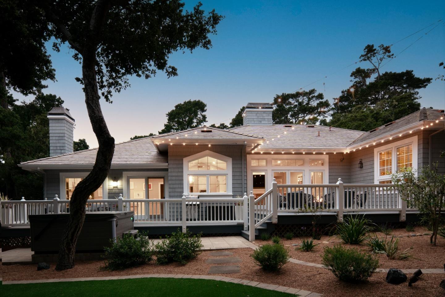 2823 Congress Road Pebble Beach, CA 93953 - Photo 39 of 49 a front view of a house with a yard and potted plants