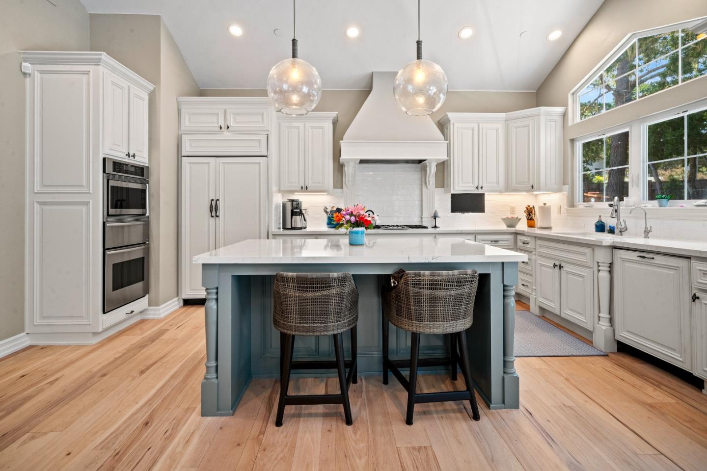 2823 Congress Road Pebble Beach, CA 93953 - Photo 4 of 49 a kitchen with a sink cabinets and wooden floor