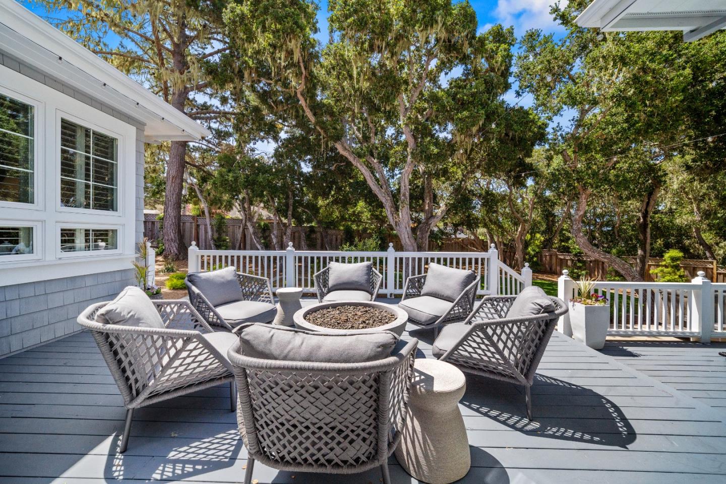 2823 Congress Road Pebble Beach, CA 93953 - Photo 41 of 49 a view of a patio with a dining table and chairs