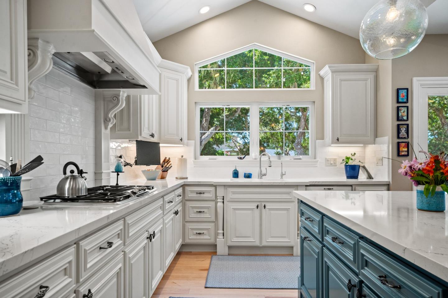 2823 Congress Road Pebble Beach, CA 93953 - Photo 6 of 49 a kitchen with a sink stove cabinets and window