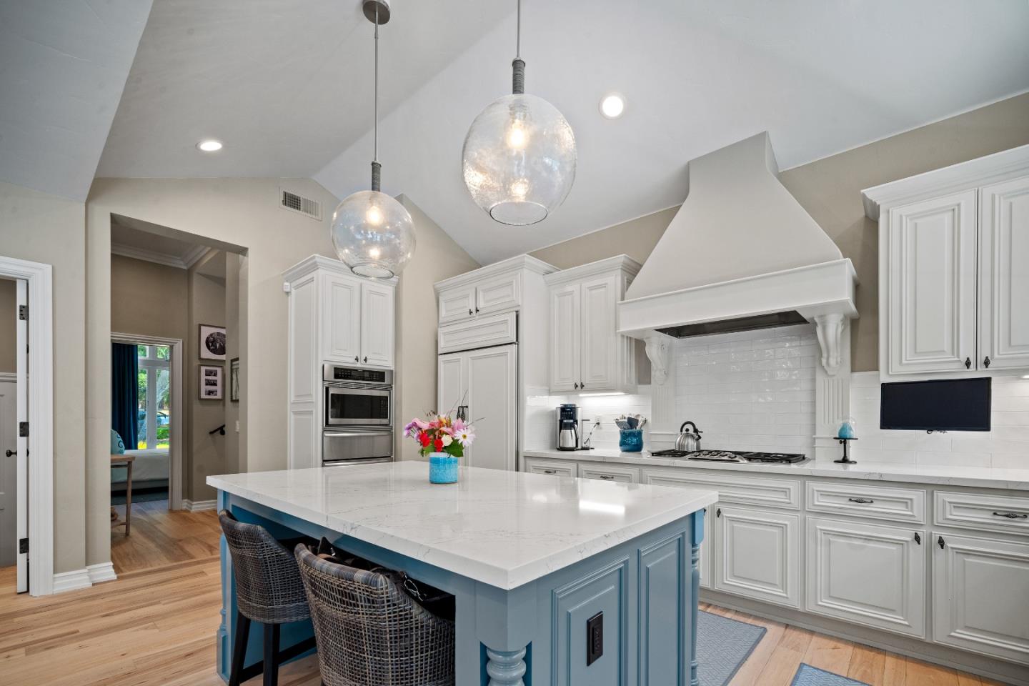 2823 Congress Road Pebble Beach, CA 93953 - Photo 8 of 49 a kitchen with cabinets table and chairs