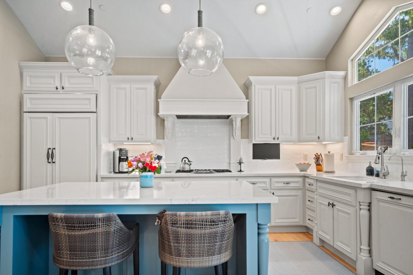 2823 Congress Road Pebble Beach, CA 93953 - Photo 9 of 49 a kitchen with a sink cabinetry and chandelier