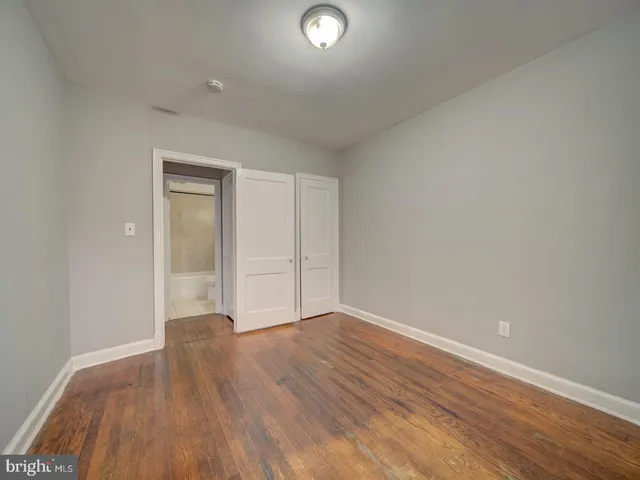 a view of an empty room and wooden floor