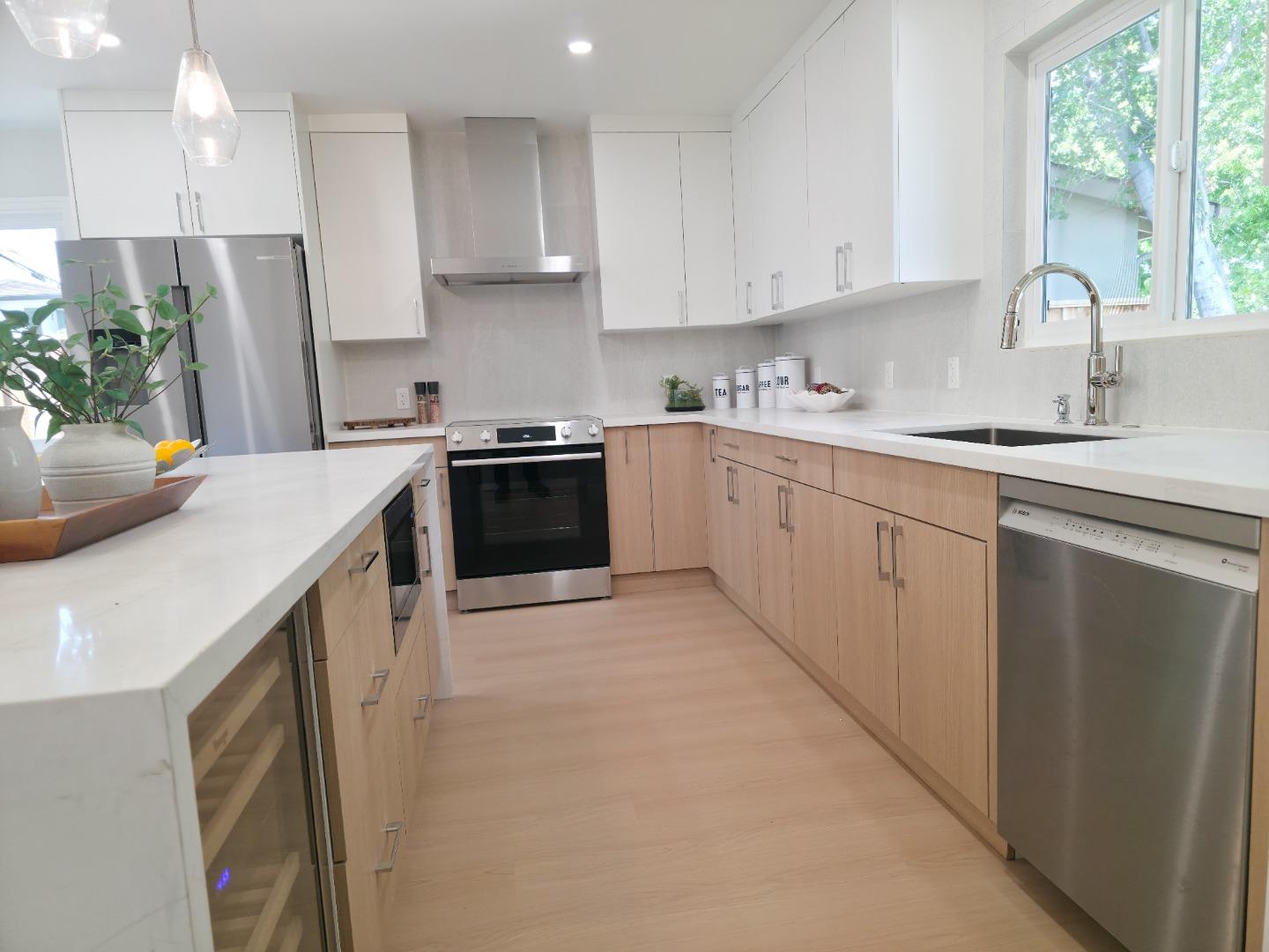 6746 Bollinger Road San Jose, CA 95129 - Photo 5 of 30 a kitchen with stainless steel appliances granite countertop a sink stove and refrigerator