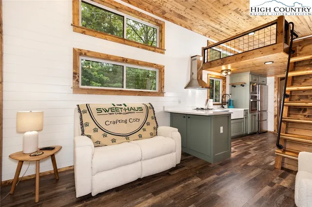 a spacious bathroom with a granite countertop sink a mirror and shower