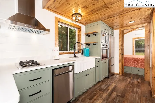 a spacious bathroom with a sink double vanity and a mirror