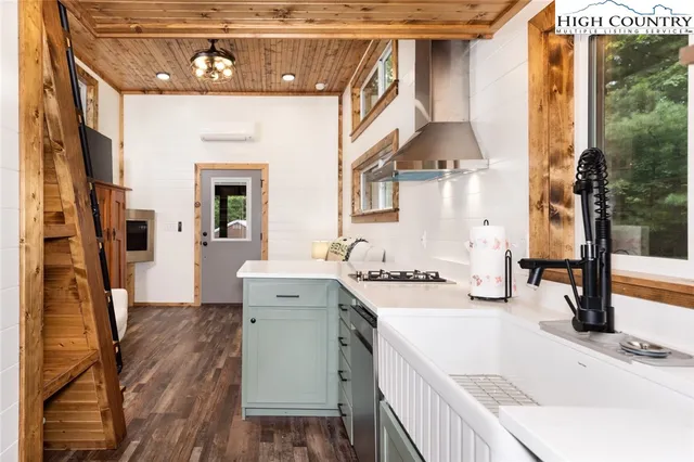 a bathroom with a sink a toilet and a window