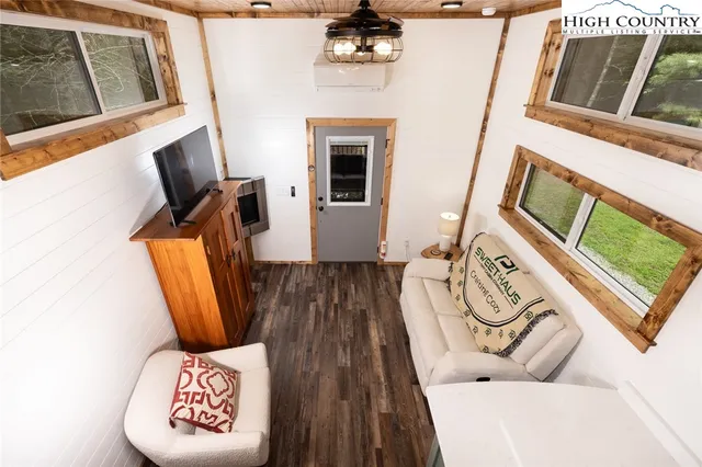 a view of a bedroom with washer and dryer