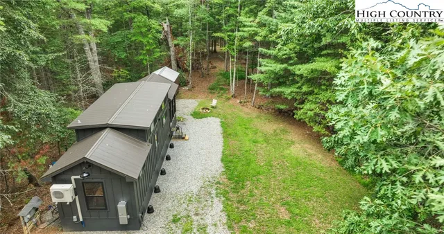 a view of yard from deck having patio