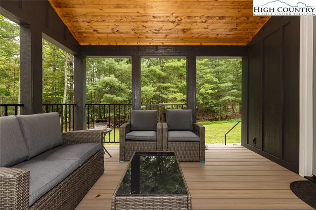 a outdoor living space with patio furniture and garden view