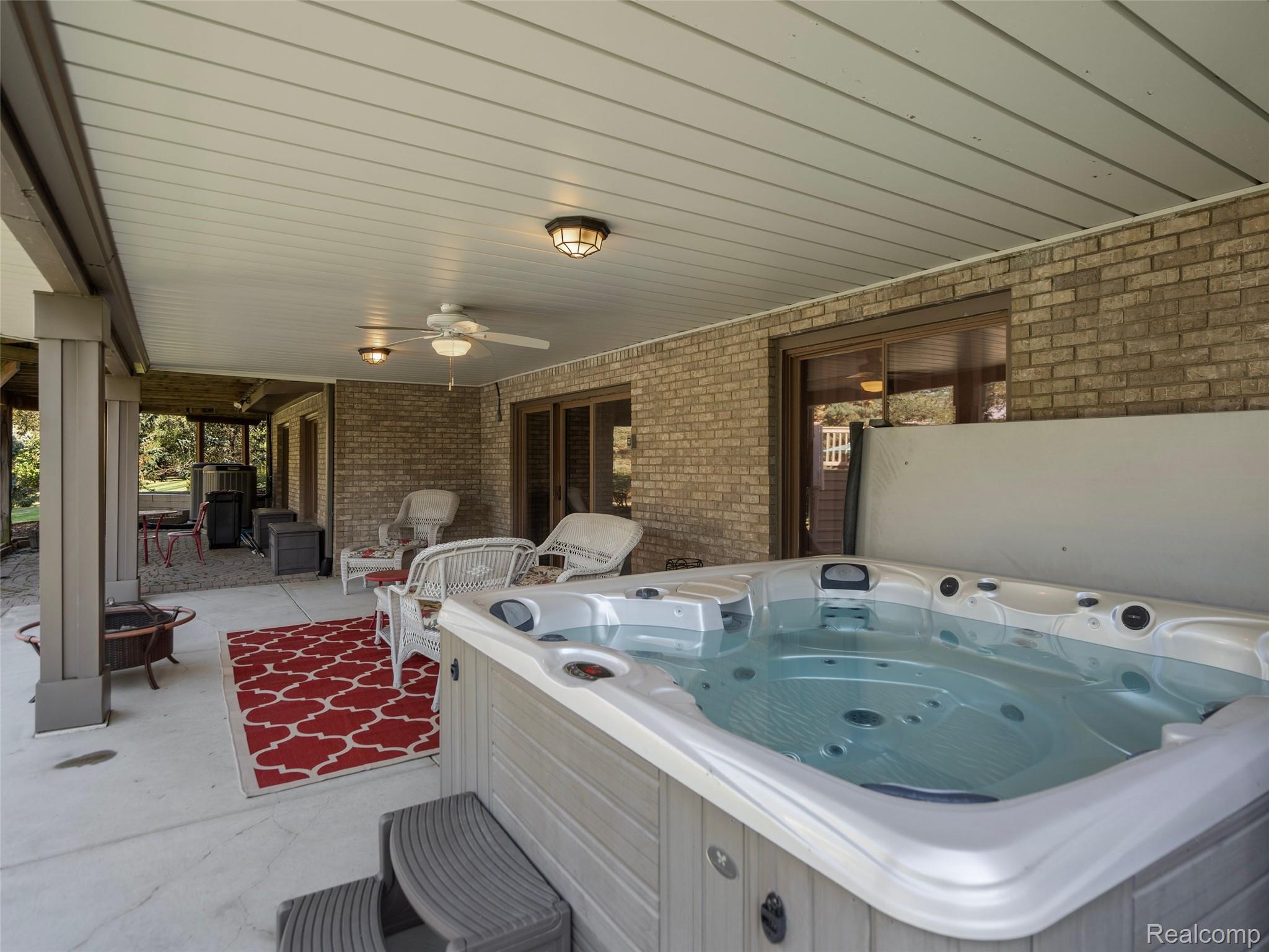 5724 Murfield Drive Rochester, MI 48306 - Photo 10 of 99 View of patio featuring a hot tub and ceiling fan