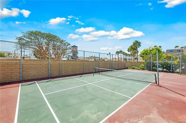 a view of swimming pool with a lounge chairs