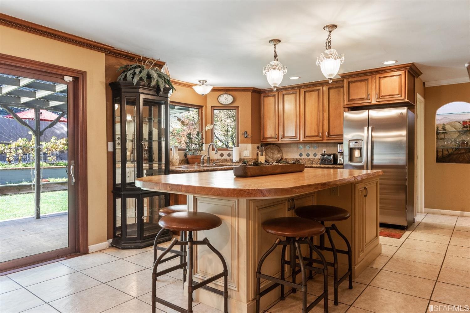 4912 John Muir Road Martinez, CA 94553 - Photo 11 of 59 a kitchen with stainless steel appliances granite countertop wooden cabinets a table and chairs