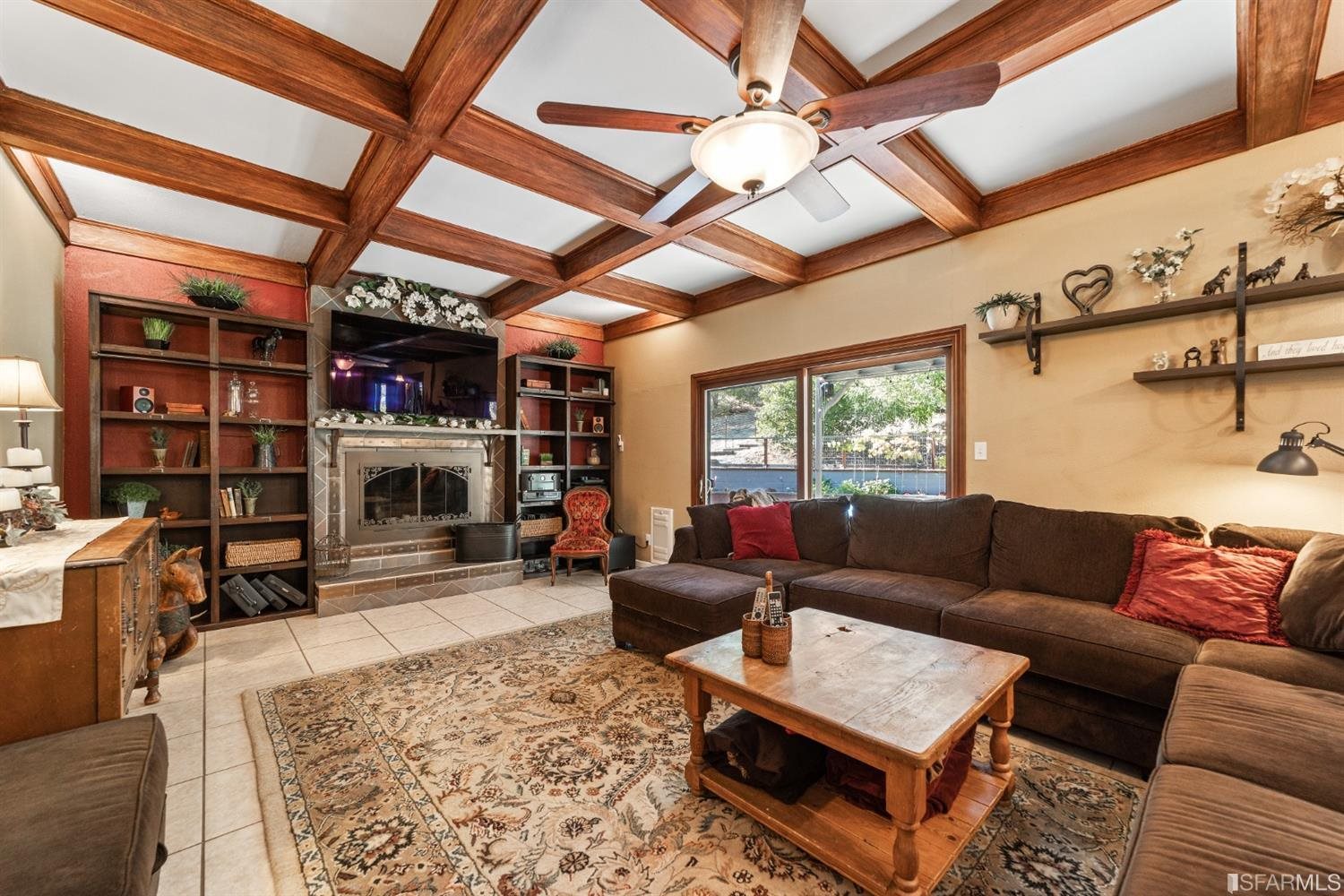 4912 John Muir Road Martinez, CA 94553 - Photo 17 of 59 a living room with furniture a fireplace and a large window