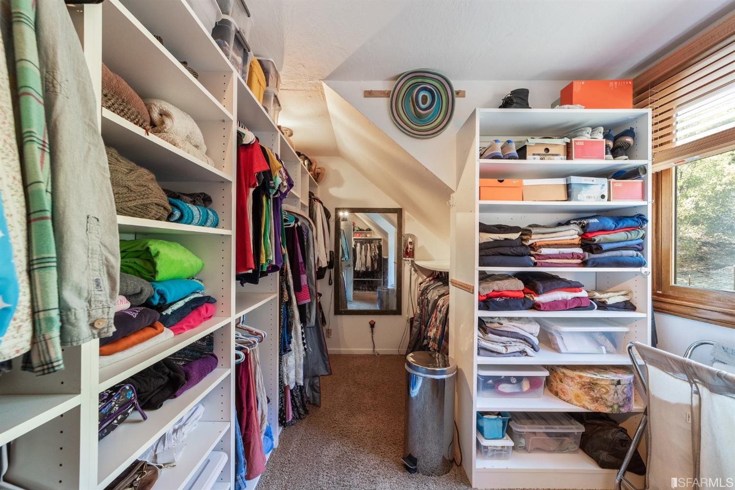 4912 John Muir Road Martinez, CA 94553 - Photo 34 of 59 a view of walk in closet with clothes and shoes