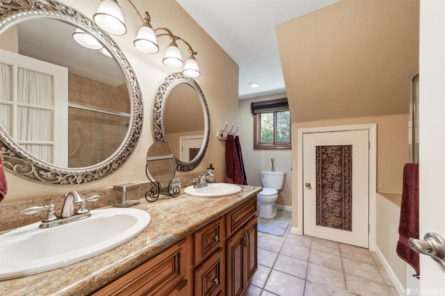 4912 John Muir Road Martinez, CA 94553 - Photo 39 of 59 a bathroom with a granite countertop double vanity sink and a mirror