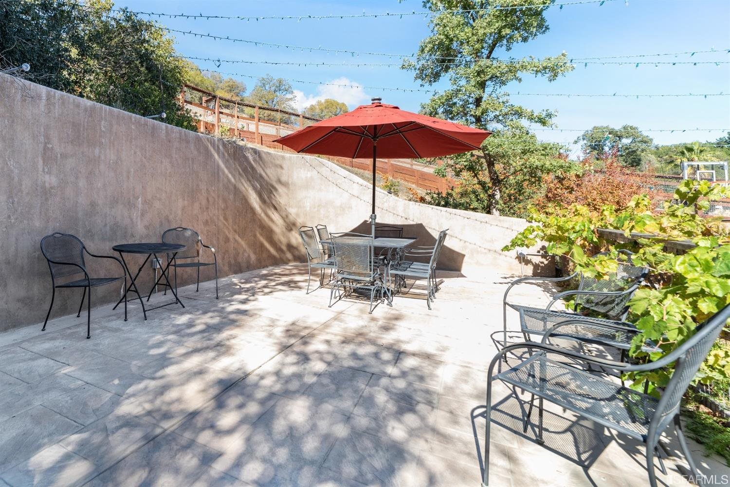4912 John Muir Road Martinez, CA 94553 - Photo 46 of 59 a view of a backyard with sitting area and furniture