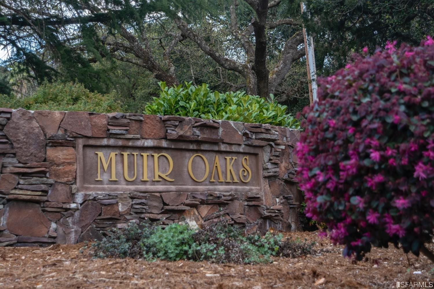 4912 John Muir Road Martinez, CA 94553 - Photo 58 of 59 a sign that is sitting in front of flowers