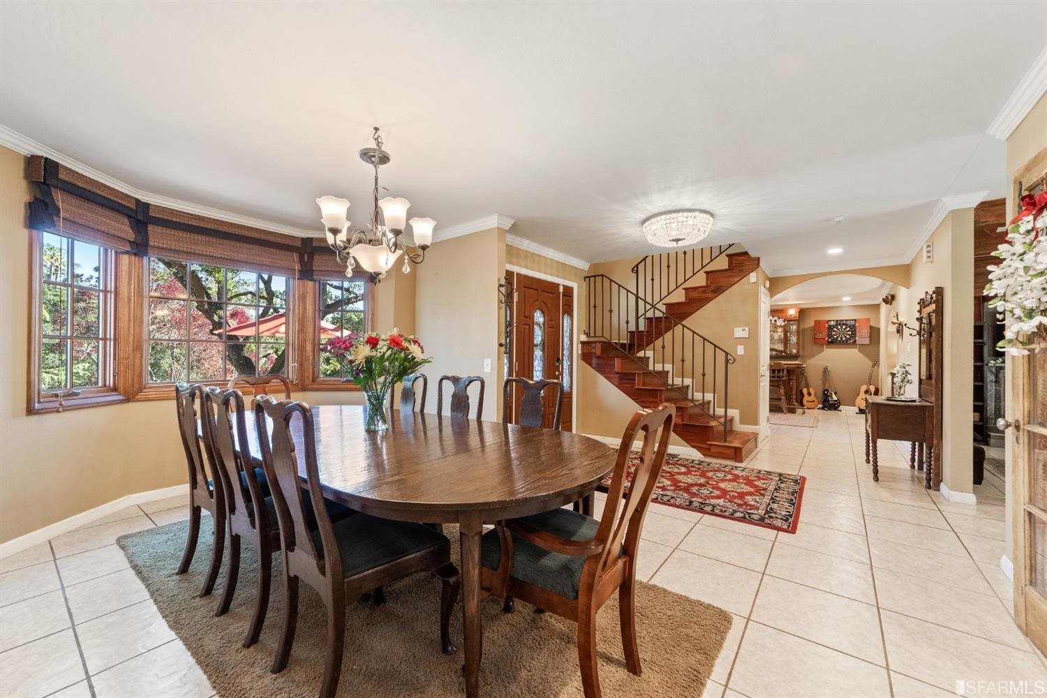 4912 John Muir Road Martinez, CA 94553 - Photo 9 of 59 a dining room with furniture a chandelier and wooden floor