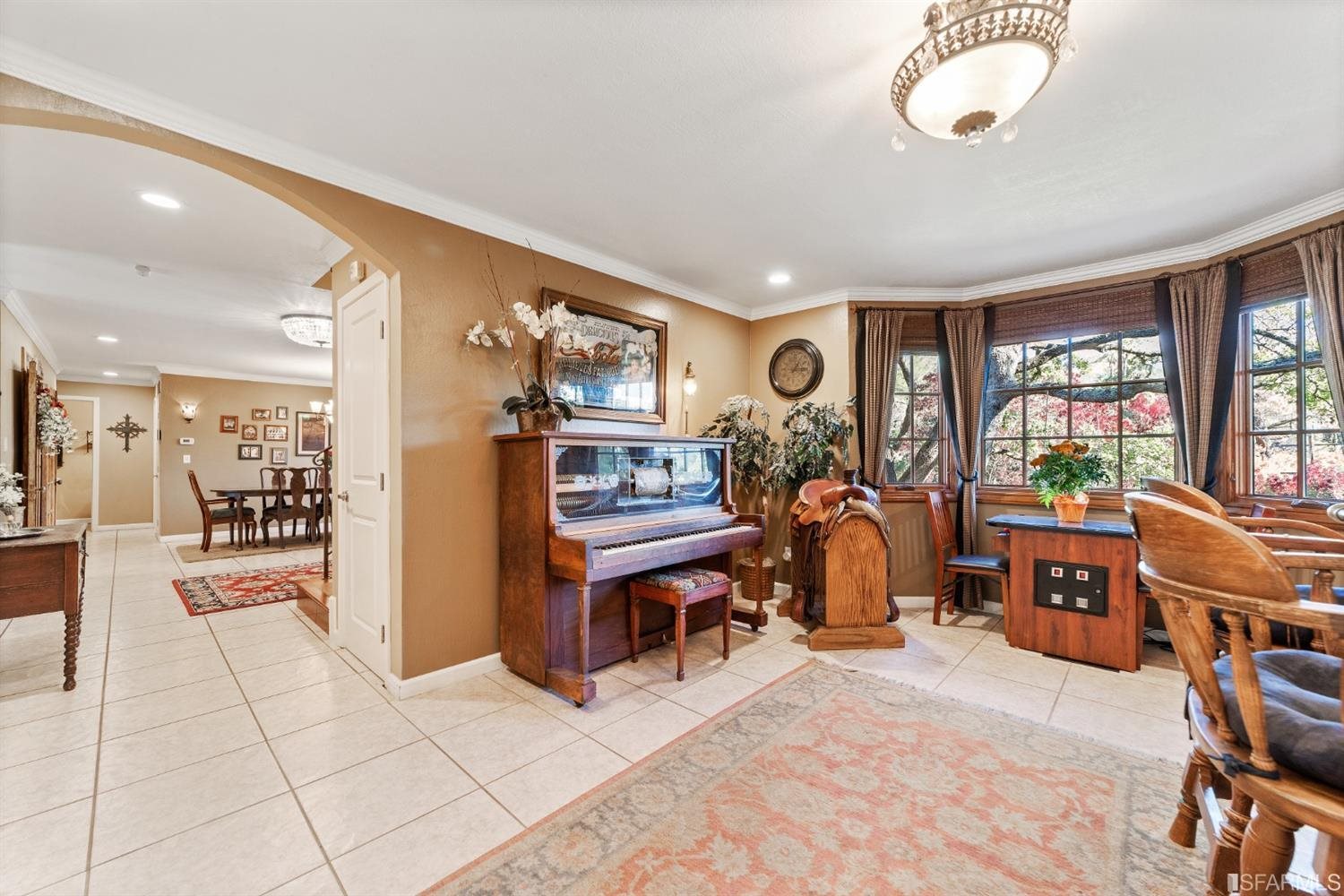 4912 John Muir Road Martinez, CA 94553 - Photo 10 of 59 a living room with furniture a flat screen tv and a large window