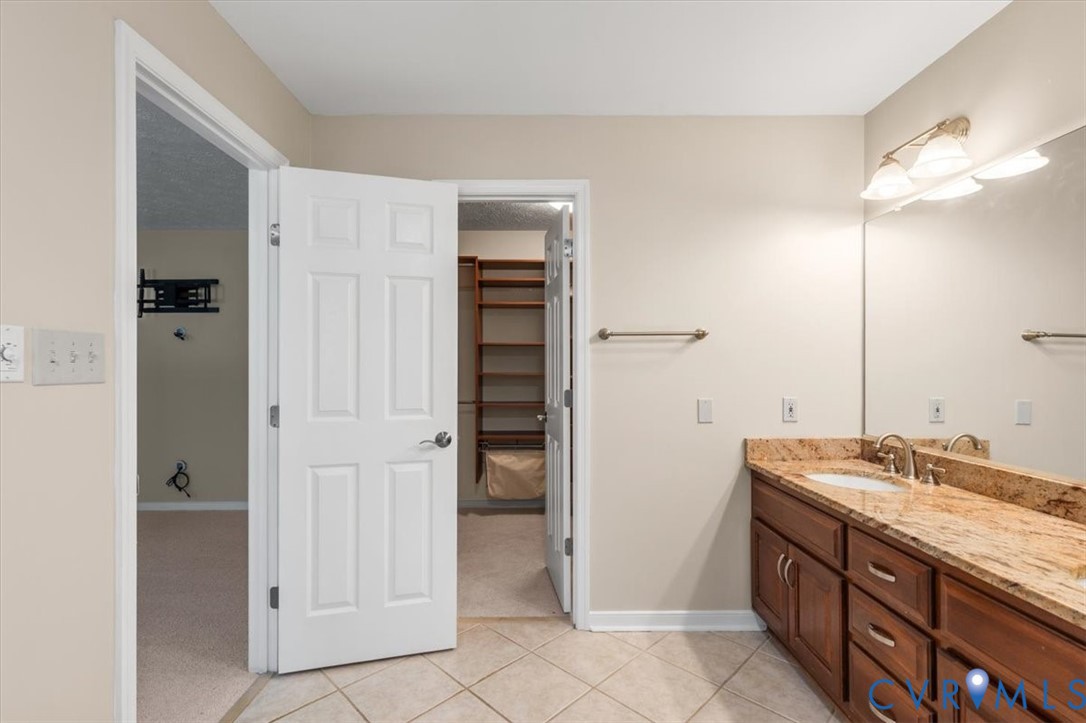 1437 Palmore Road Powhatan, VA 23139 - Photo 31 of 60 Bathroom featuring a double vanity with stone coun