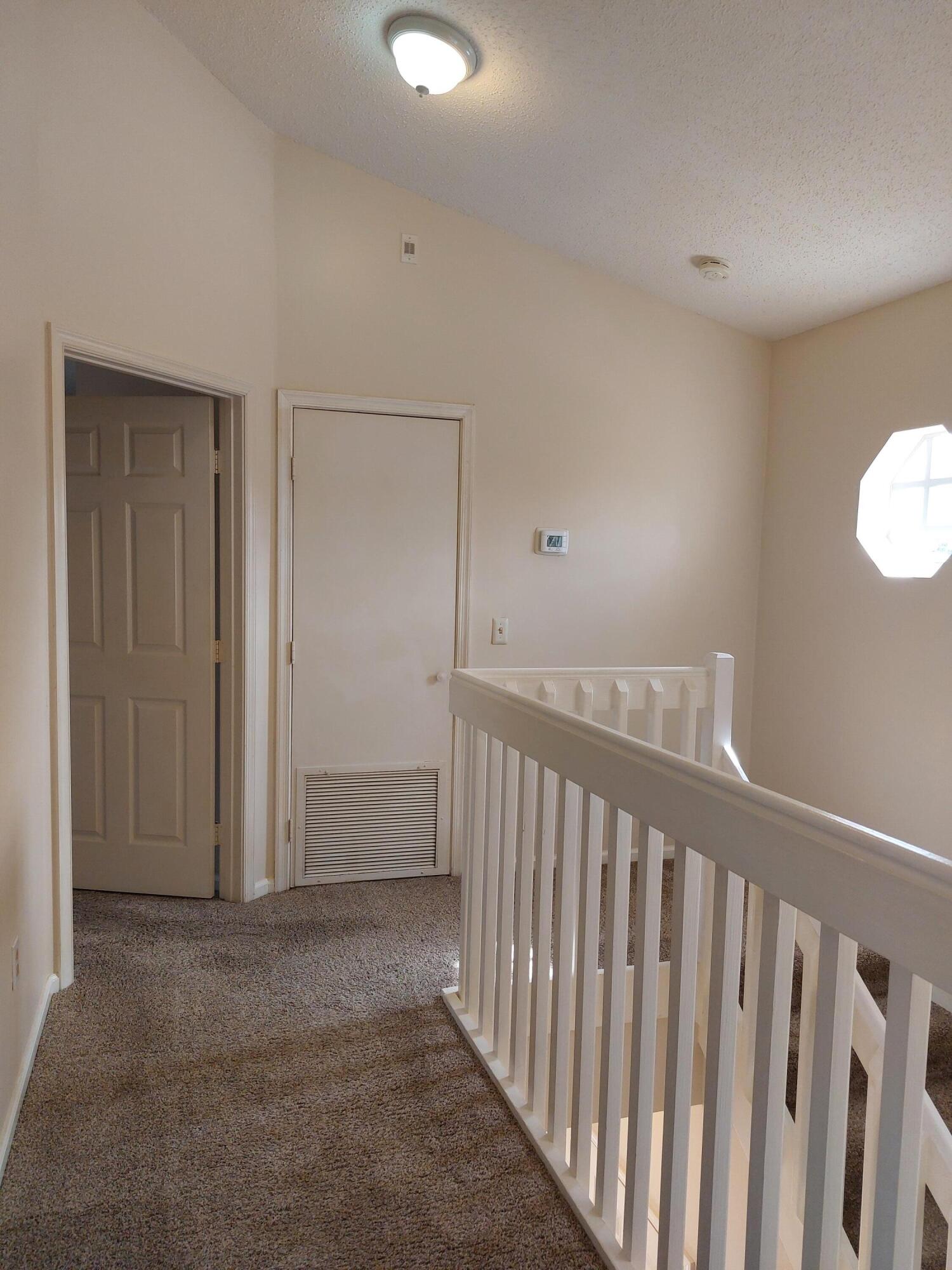 331 Oak Crest Terrace, Unit 331 Jupiter, FL 33458 - Photo 14 of 29 a view of a hallway with entryway