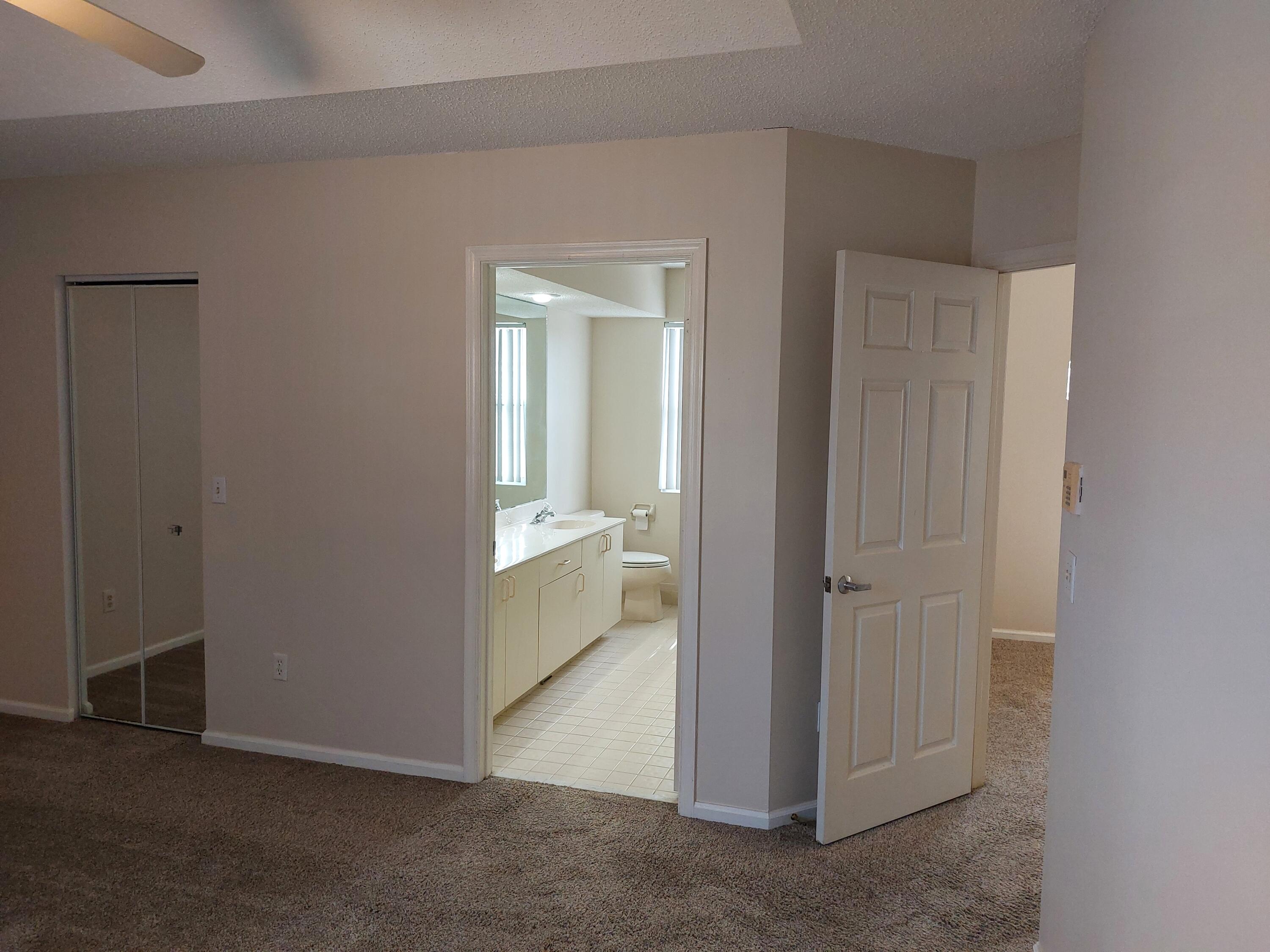 331 Oak Crest Terrace, Unit 331 Jupiter, FL 33458 - Photo 16 of 29 an entryway with a livingroom