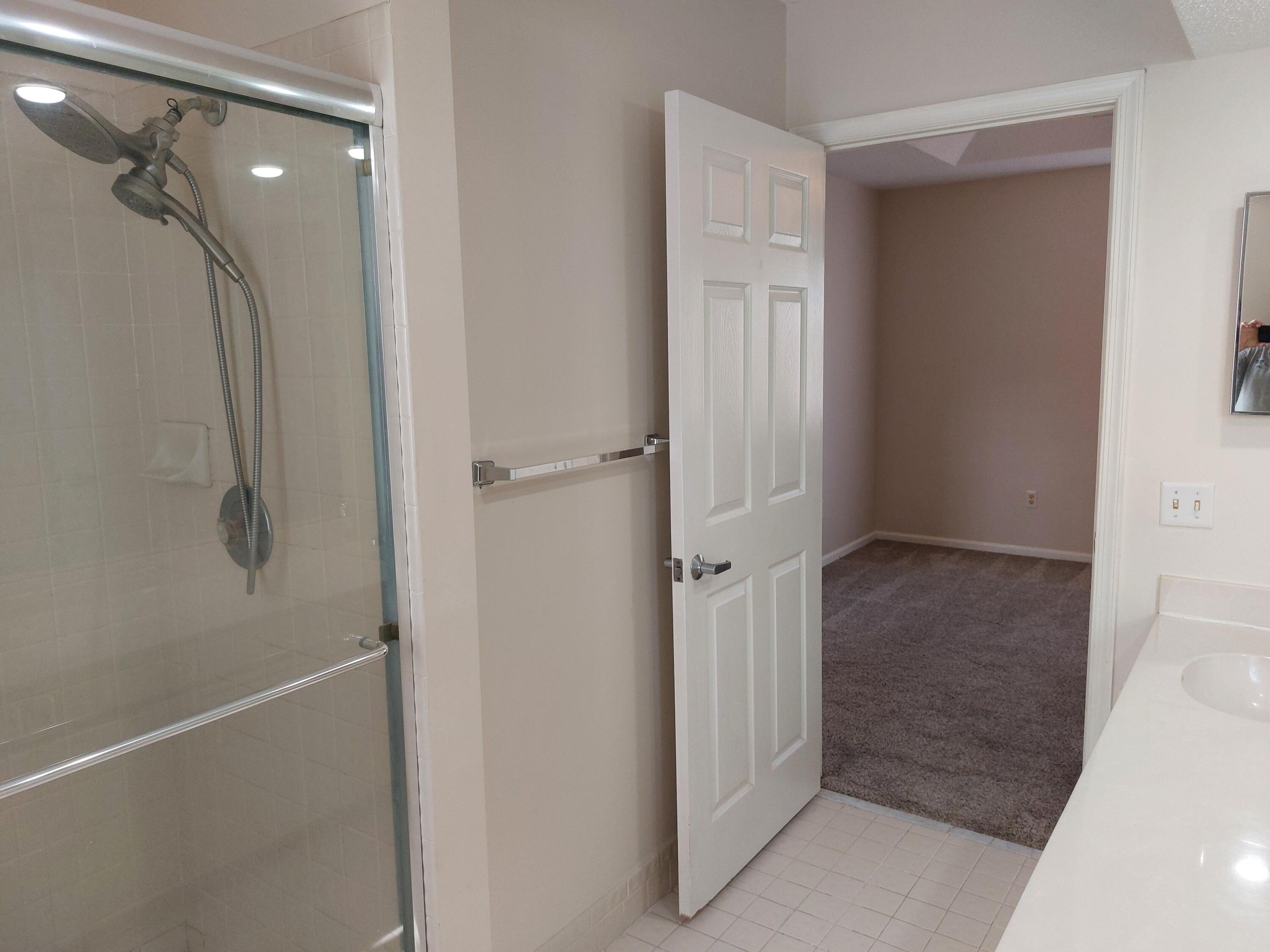 331 Oak Crest Terrace, Unit 331 Jupiter, FL 33458 - Photo 20 of 29 a bathroom with a shower