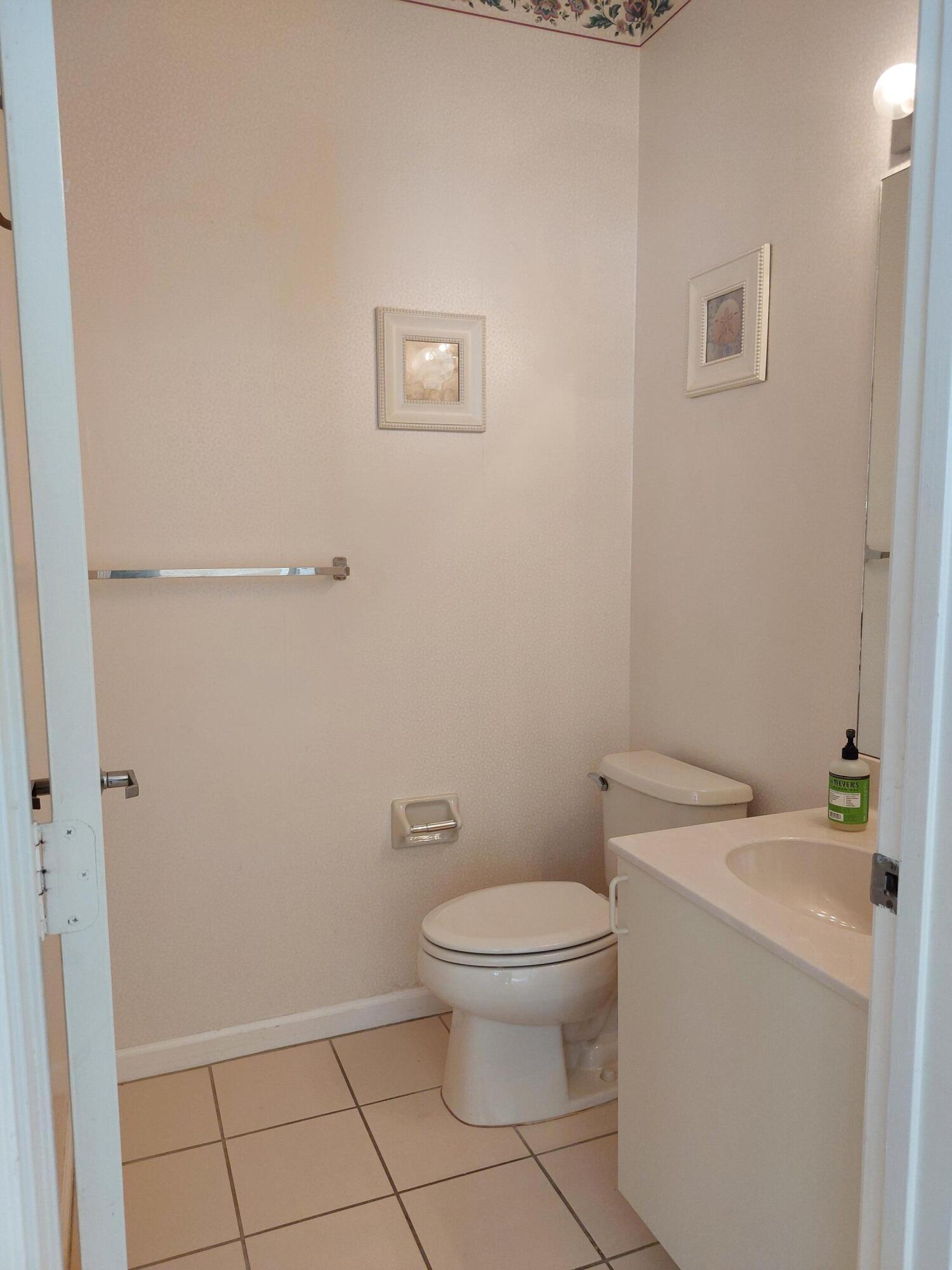 331 Oak Crest Terrace, Unit 331 Jupiter, FL 33458 - Photo 3 of 29 a white toilet sitting next to a shower