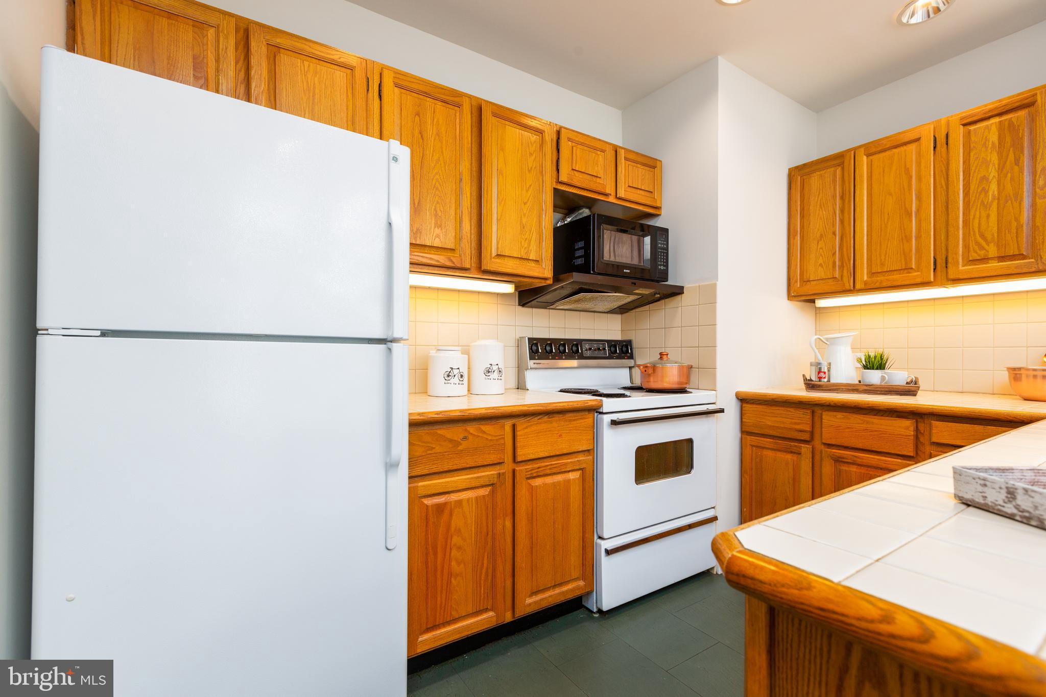 9004 Bradford Road Silver Spring, MD 20901 - Photo 12 of 60 Kitchen with Under-Cabinet Lighting
