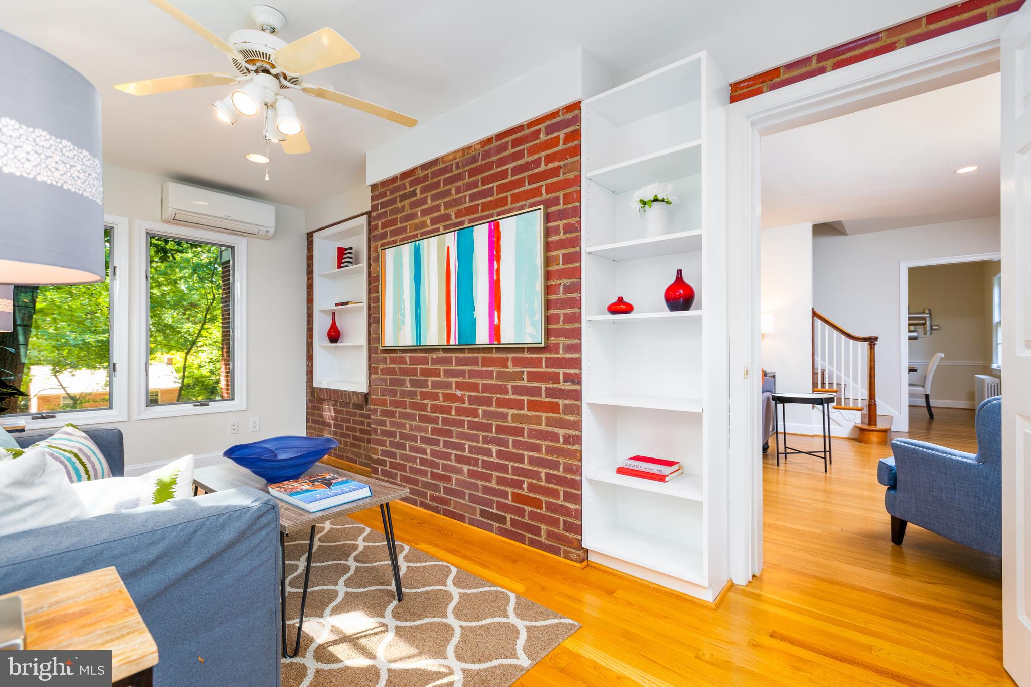 9004 Bradford Road Silver Spring, MD 20901 - Photo 8 of 60 Sunroom with Built-In Bookcases and Exposed Brick