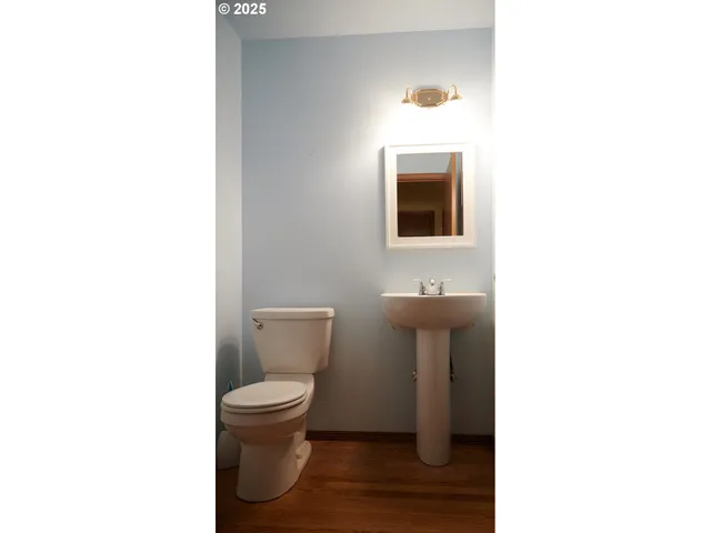 a bathroom with a toilet and a sink