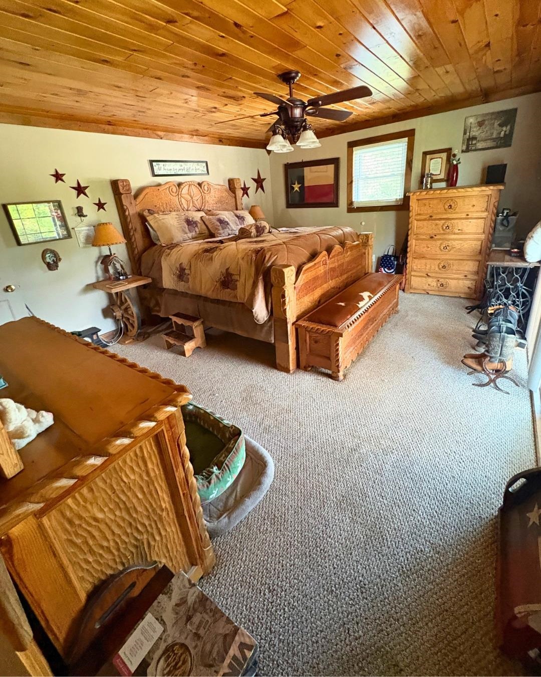 772 Rushing Road Michie, TN 38357 - Photo 9 of 19 Carpeted room featuring a wood-planked ceiling, ceiling fan with light fixture, and neutral wall tones
