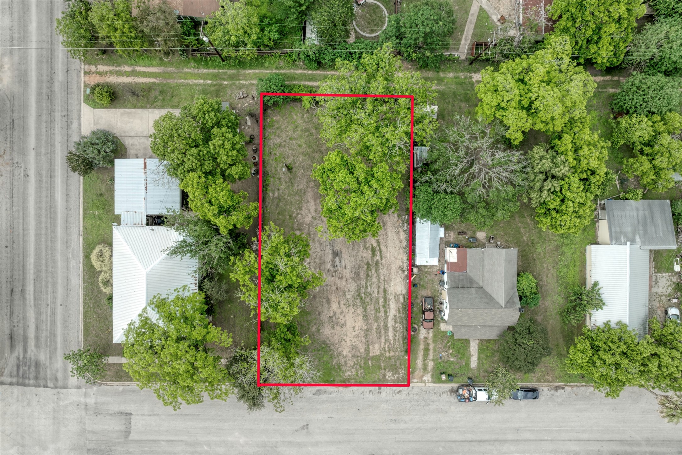 809 East Fannin Street Luling, TX 78648 - Photo 13 of 16 an aerial view of a house with a yard and a fountain