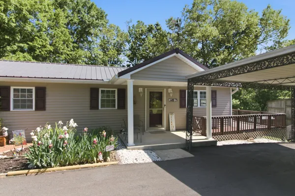 front view of a house with a garden