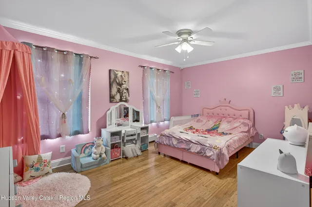 a living room with furniture and a lamp