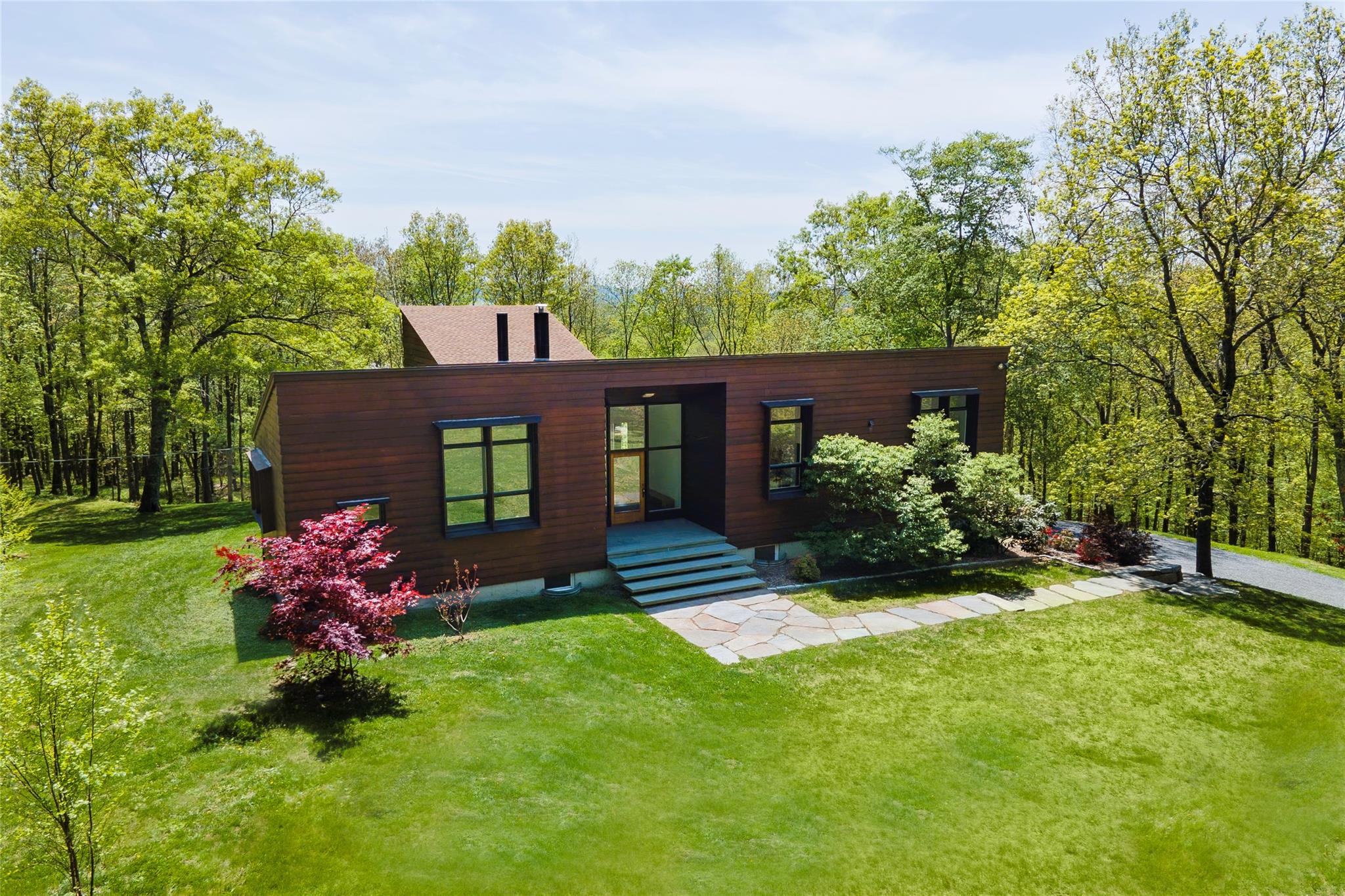 82 Moadock Road Millerton, NY 12546 - Photo 1 of 1 Modern home with a front yard