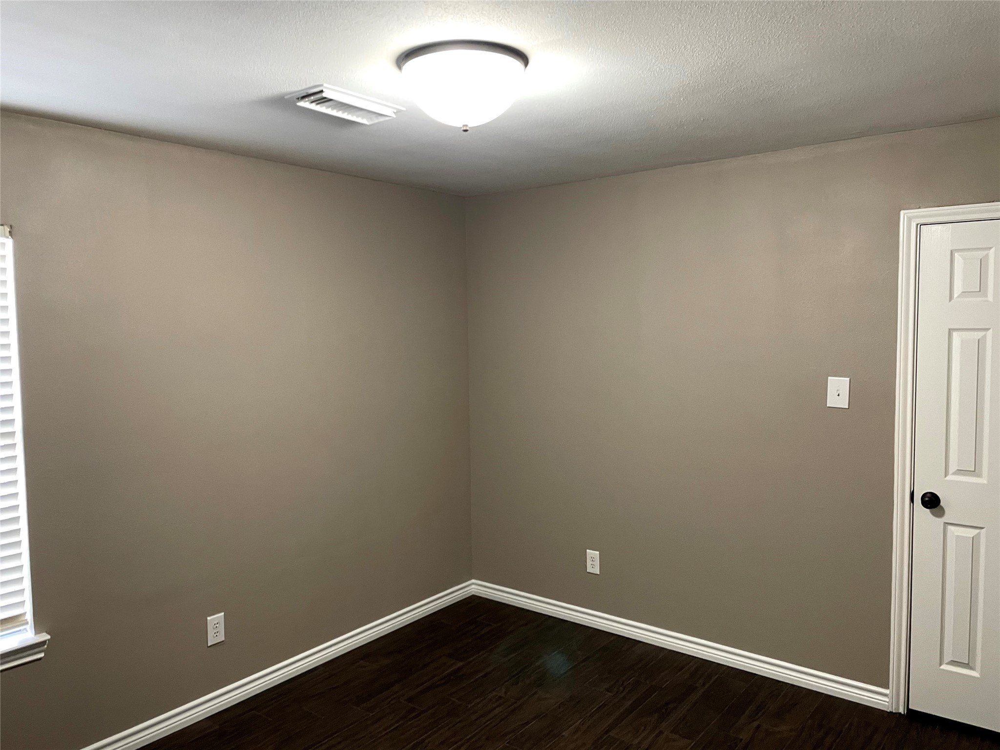 2314 Colonial Springs Lane Spring, TX 77386 - Photo 19 of 22 an empty room with wooden floor and windows