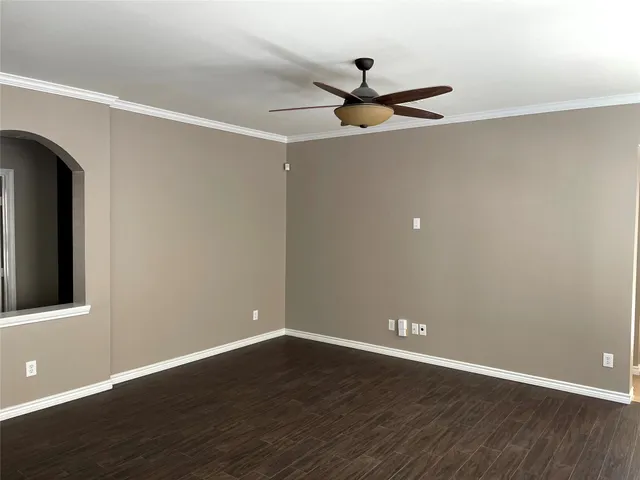 a view of a big room with wooden floor closet and windows
