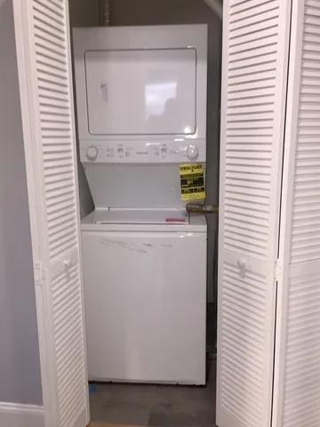 a view of a bathroom with a washer and dryer