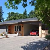 a view of a car parked in front of a house