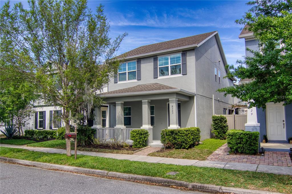 a view of a house with a yard and plants