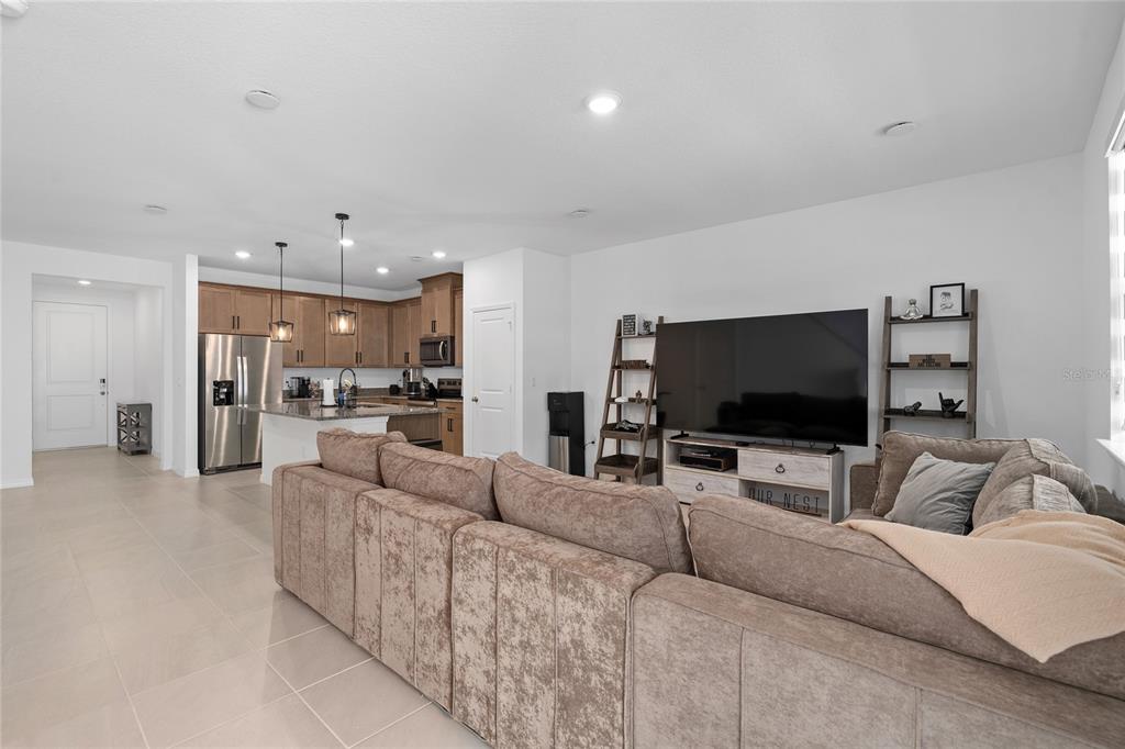 655 Clark Street Oviedo, FL 32765 - Photo 15 of 44 a living room with furniture and a flat screen tv