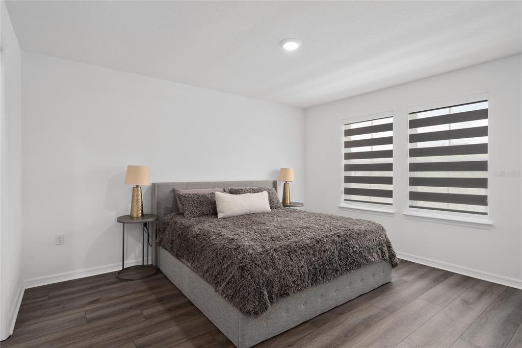 655 Clark Street Oviedo, FL 32765 - Photo 23 of 44 a bedroom with a bed and a window