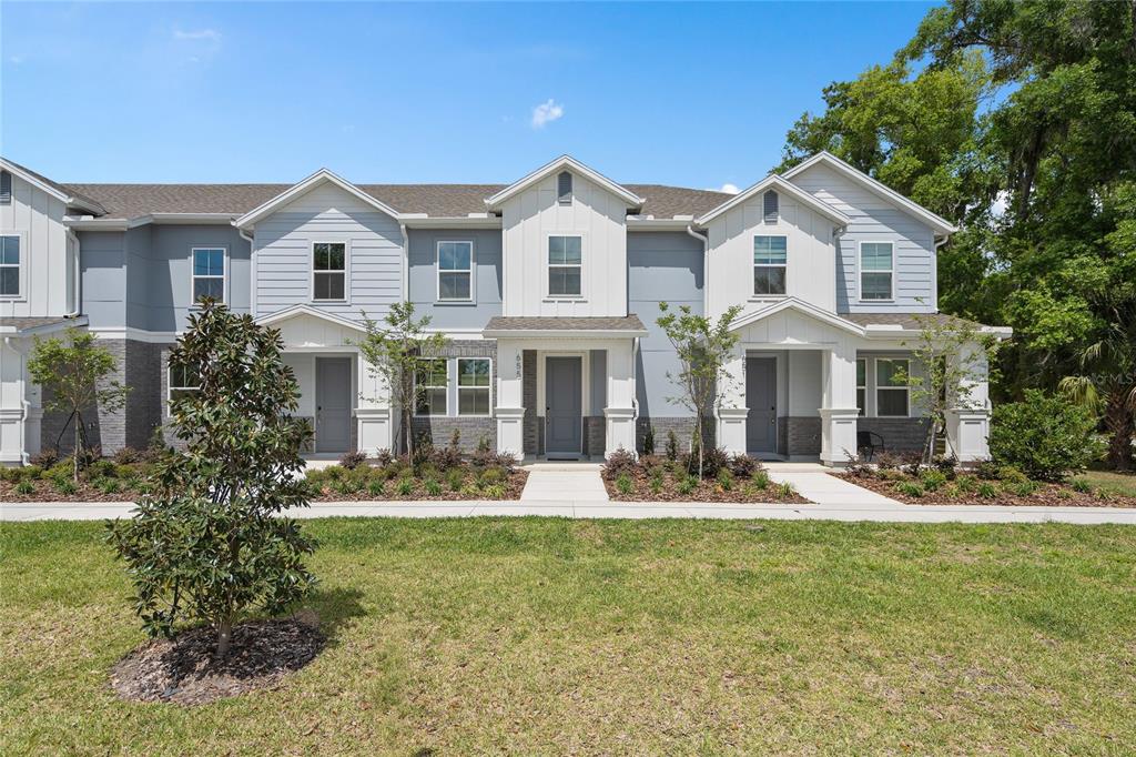 655 Clark Street Oviedo, FL 32765 - Photo 27 of 44 a front view of a house with garden and porch