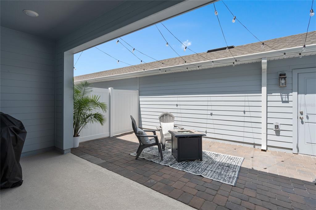 655 Clark Street Oviedo, FL 32765 - Photo 29 of 44 a view of a porch with furniture and a yard
