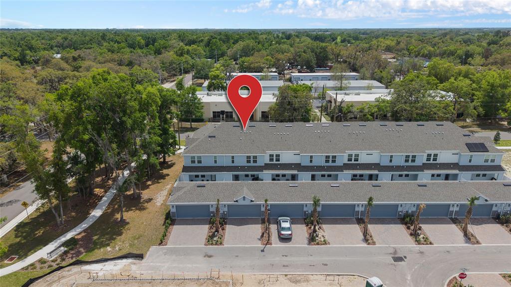 655 Clark Street Oviedo, FL 32765 - Photo 35 of 44 a view of a swimming pool with a table and chairs