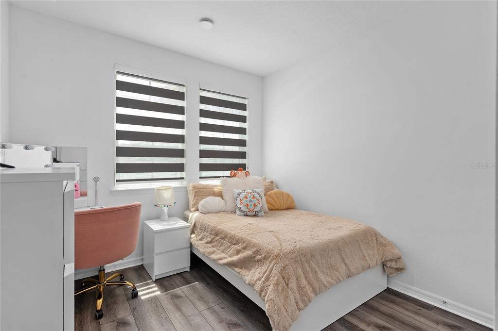 655 Clark Street Oviedo, FL 32765 - Photo 4 of 44 a bedroom with a bed and a window