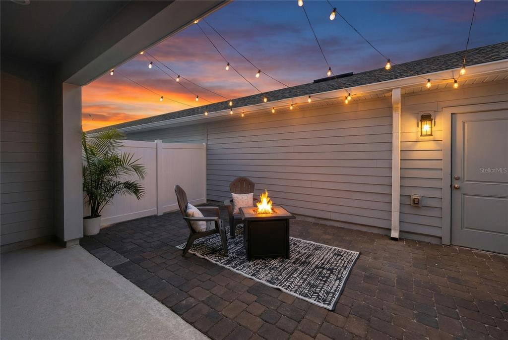 655 Clark Street Oviedo, FL 32765 - Photo 42 of 44 a backyard of a house with yard and outdoor seating