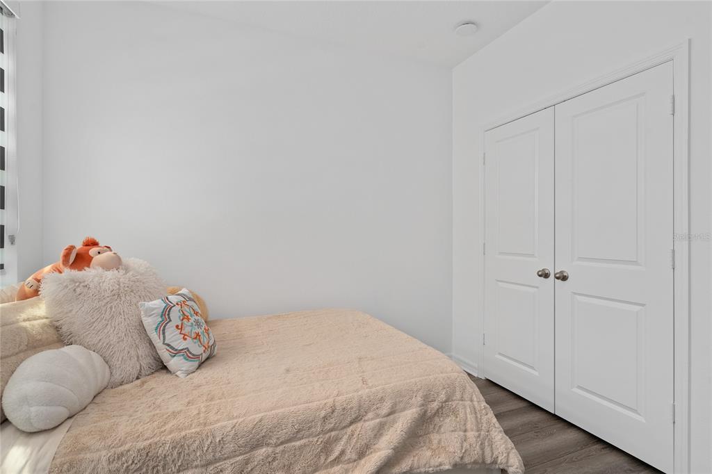 655 Clark Street Oviedo, FL 32765 - Photo 5 of 44 a bedroom with a bed and a painting on the wall